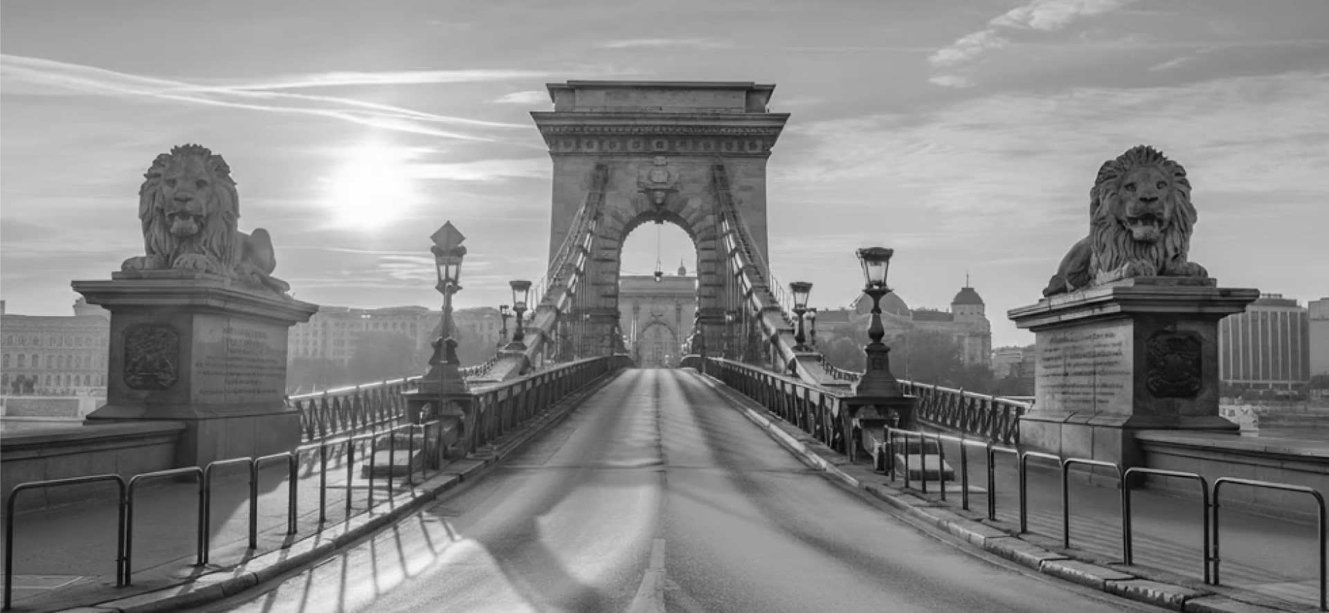 Chain Bridge with lion statues at sunrise — calm, confident new beginnings